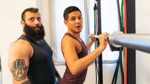Mischievous trainer, Markus Kage, is at it again! When a new client, Alex Montenegro, and he meet for their first session, the hairy, muscled tattooed trainer is told that he wants to work on his butt.