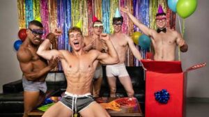 Felix Fox's buddies have got him a special surprise for his birthday bash: Michael Boston, who jumps out of a wrapped present wearing nothing but a pair of tight briefs and a bowtie to give Felix a lap dance.