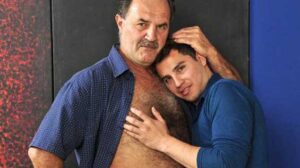 Handsome Hackman in his first gay scene. He is woken up by a gorgeous horny Agustin and Daddy has no other choice than letting his boy fantasies go wild.