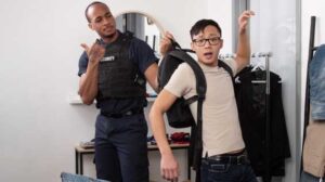 Handsome security hunk Trent King keeps a close eye on bespectacled twink Dane Jaxon as he browses at the menswear store, and when Dane sets off the alarm when he leaves, Trent gives him a thorough pat-down!