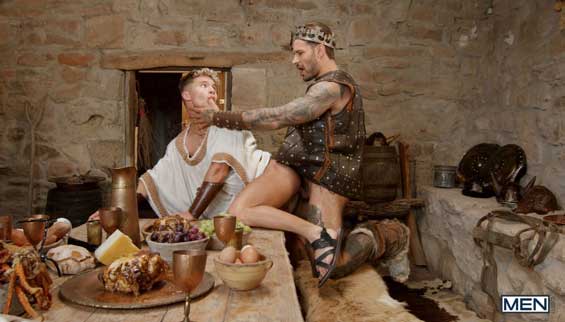 King of the Norsemen Papi Kocic thinks it's just another day, feasting with his fiercest warriors, servant twink Dean Young sitting on his lap and refilling his goblet...