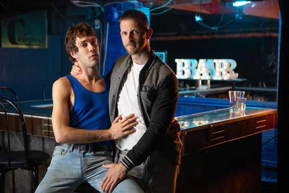 It's Chris Cool's first shift at the bar, and experienced bartender Paul Wagner gives him a little pep talk... but it's more action than words. Paul slowly strips and strokes his cock, and Chris eagerly sucks it as the top fingers his hole.