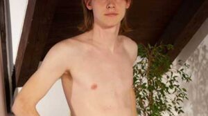 Axel Ross rubs his pants as a helping hand arrives. The hands run over Axel's clothed body. Soon Axel's tee shirt is removed and he runs a hand over his chest as his groin is rubbed too.