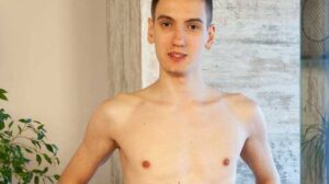 Alan Doux has a helper as he sits in the chair. The helping hands reach over and rub Alan's chest, through his tee shirt. Then the tee shirt is removed and that sexy chest is rubbed more.