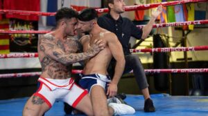 Wrestlers Alex Ink and Jolian are ready for their match, and when the referee blows his whistle, it's on to see who will be first to pin the other! After some jockeying for position